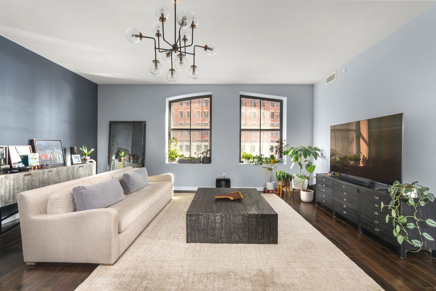 Tribeca loft interior with soaring ceilings and oversized windows